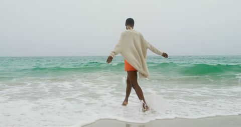 Joyful Expression at the Ocean's Edge