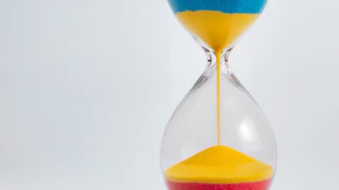 Colorful Hourglass Sand Dripping to Bottom in Sequence