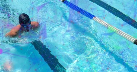 Athletic Swimmer Training in Bright Pool Lane Splashing Water