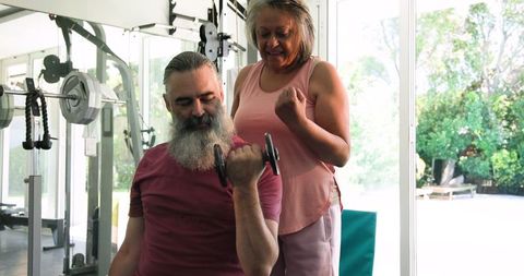 Senior Couple Engaging in Home Workout with Weights