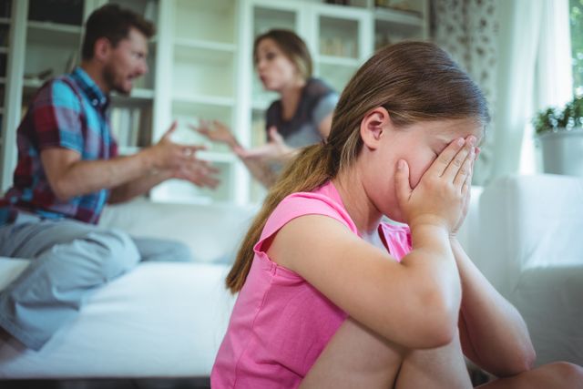 Sad Girl Covering Face While Parents Arguing at Home - Download Free Stock Photos Pikwizard.com
