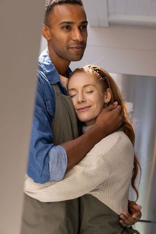 Lovely Couple Embracing Peacefully in Cozy Kitchen Ambience