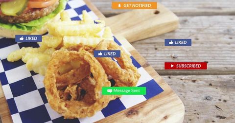 Crispy onion rings and crinkle fries on rustic cutting board with burger and social badges