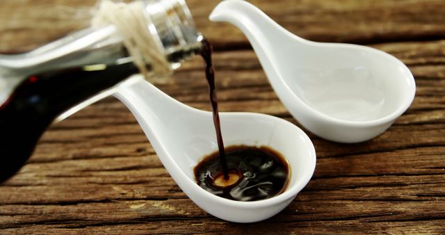 Pouring Soy Sauce Into White Porcelain Spoon - Download Free Stock Images Pikwizard.com