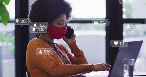 Businesswoman Engaging on Social Media with Virtual Interaction Icons