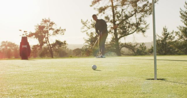 Image of caucasian man playing golf on golf field. sporty, active lifestyle and playing golf concept.