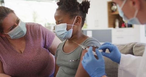 Vaccination Process for Child with Supportive Parent and Medical Staff