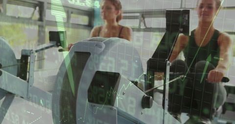 Women training on rowing machines with financial chart overlay