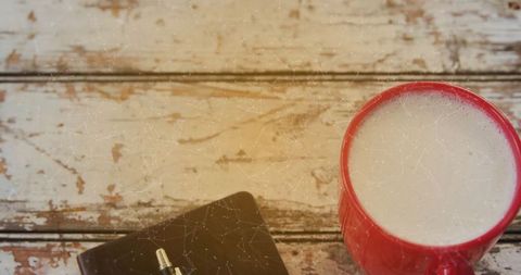 Cozy morning coffee with notebook on rustic wooden table