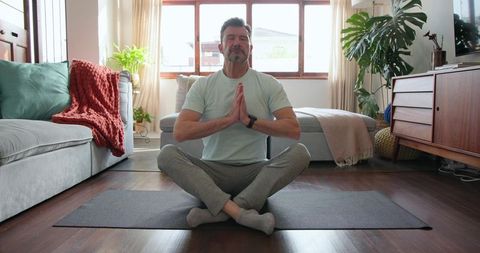 Gentleman Practicing Meditation in Cozy Living Room