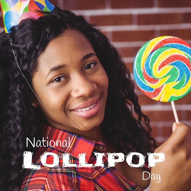 Portrait of cute smiling african american girl holding candy with national lollipop day text. digital composite, sweet food and celebration concept, party, lollipop, childhood.