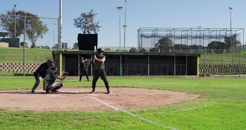 Amateur Baseball Batter Preparing to Hit at Community Ballpark with Umpire and Catcher
