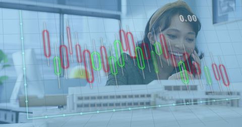 Asian businesswoman analyzing financial data at office desk