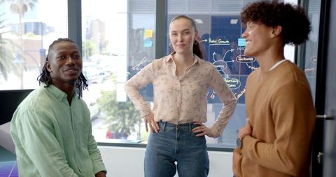 Young professionals engaged in creative office discussion