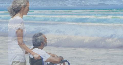 Senior couple enjoying beachfront serenity in wheelchair