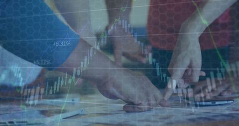 Business Team Analyzing Financial Data on Desk