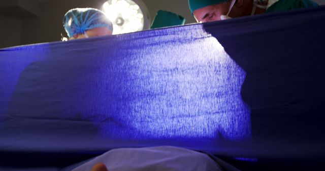 Surgeons Performing Surgery with Barrier Drapes in Operating Room - Download Free Stock Images Pikwizard.com