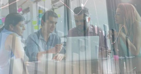 Diverse business team collaborating, analyzing digital data on laptop with charts overlay