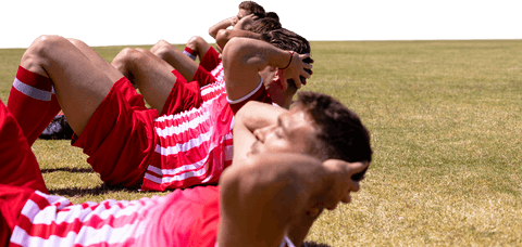 Diverse football team exercising on transparent pitch background