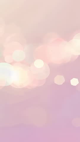 Drifting Pastel Bokeh Lights Over Pink Lavender Gradient Vertical Mobile Background