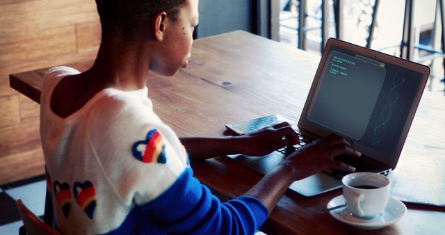 Young Woman Coding on Laptop in Coffee Shop - Download Free Stock Images Pikwizard.com