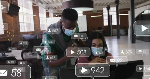 Colleagues Analyzing Social Media Metrics in Modern Office