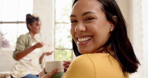 Joyful Mother and Daughter Enjoying Cozy Moment in Kitchen
