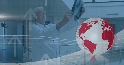senior doctor analyzing x-ray with global digital interface overlay - Download Free Stock Images Pikwizard.com