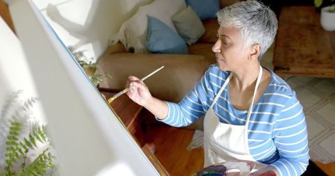 Senior Woman Enjoying Painting at Home