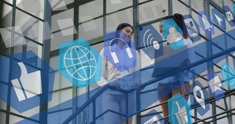 Diverse Business Women Discuss Digital Interface Concepts in Modern Office