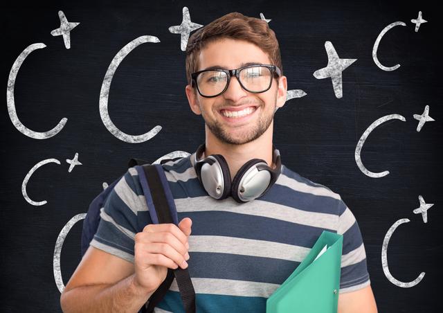 Young male college student smiling while carrying a backpack and a file, wearing headphones around his neck. Chalkboard background with C+ signs. Ideal for educational content, student life promotions, back-to-school campaigns, and academic success themes.
