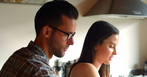 Couple Enjoy Cooking Together in Modern Kitchen