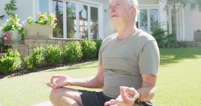 Senior Man Meditating in Garden with Peaceful Expression - Download Free Stock Images Pikwizard.com