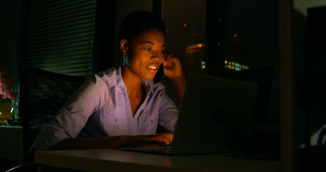 African American Woman Working Late Night on Laptop in Office - Download Free Stock Images Pikwizard.com