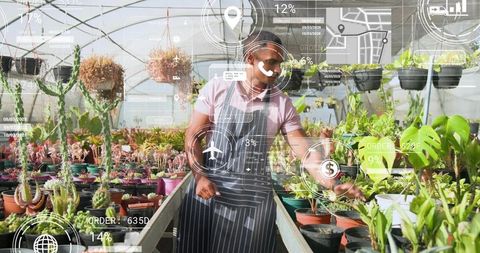 Greenhouse worker inspecting plants with augmented reality overlays and nursery data
