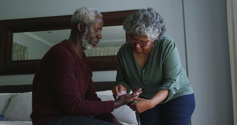 Senior Couple Learning to Use Technology at Home Together