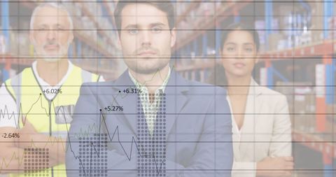 Business Professionals Analyzing Growth Statistics in Warehouse Setting