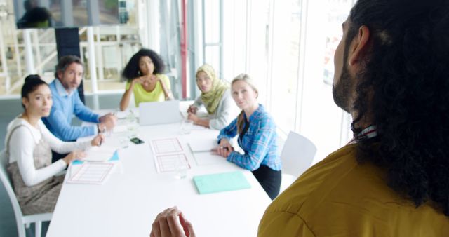 Business Team in Meeting with Diverse Group Listening to Presentation - Download Free Stock Images Pikwizard.com