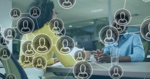 Colleagues Collaborating with Digital Networks in Modern Office