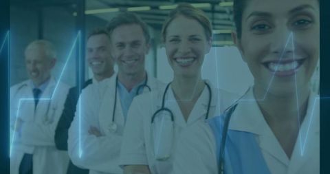 Smiling Medical Staff Standing in Modern Hospital Corridor