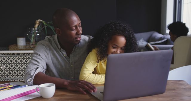 Father and Daughter Using Laptop at Home - Download Free Stock Images Pikwizard.com