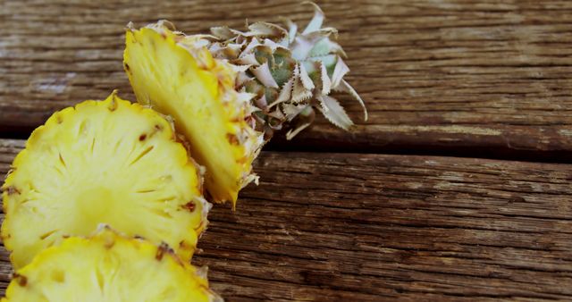 Close-Up of Pineapple Slices on Rustic Wooden Surface - Download Free Stock Images Pikwizard.com
