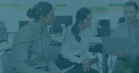 Diverse Business People Collaborating on Financial Data Analysis in Office