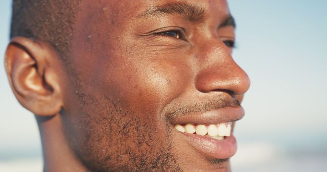 Close-up of smiling African American man enjoying the outdoors - Download Free Stock Images Pikwizard.com