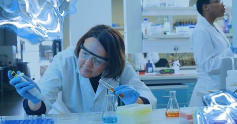 Scientist conducting experiment in advanced laboratory