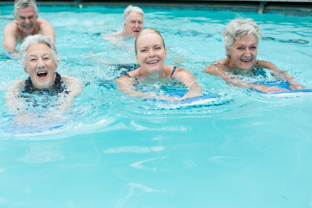 Portrait of senior swimmers enjoying in pool