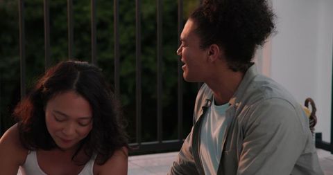 Couple sharing tender moment outdoors at sunset