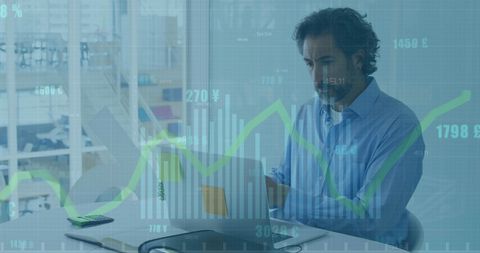 Businessman Analyzing Financial Data on Laptop with Overlay Charts - Download Free Stock Images Pikwizard.com