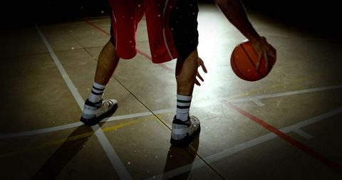 Male Athlete Practicing Dribbling on Indoor Basketball Court