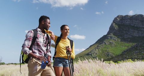 Happy Couple Hiking in Mountain Wilderness Adventure